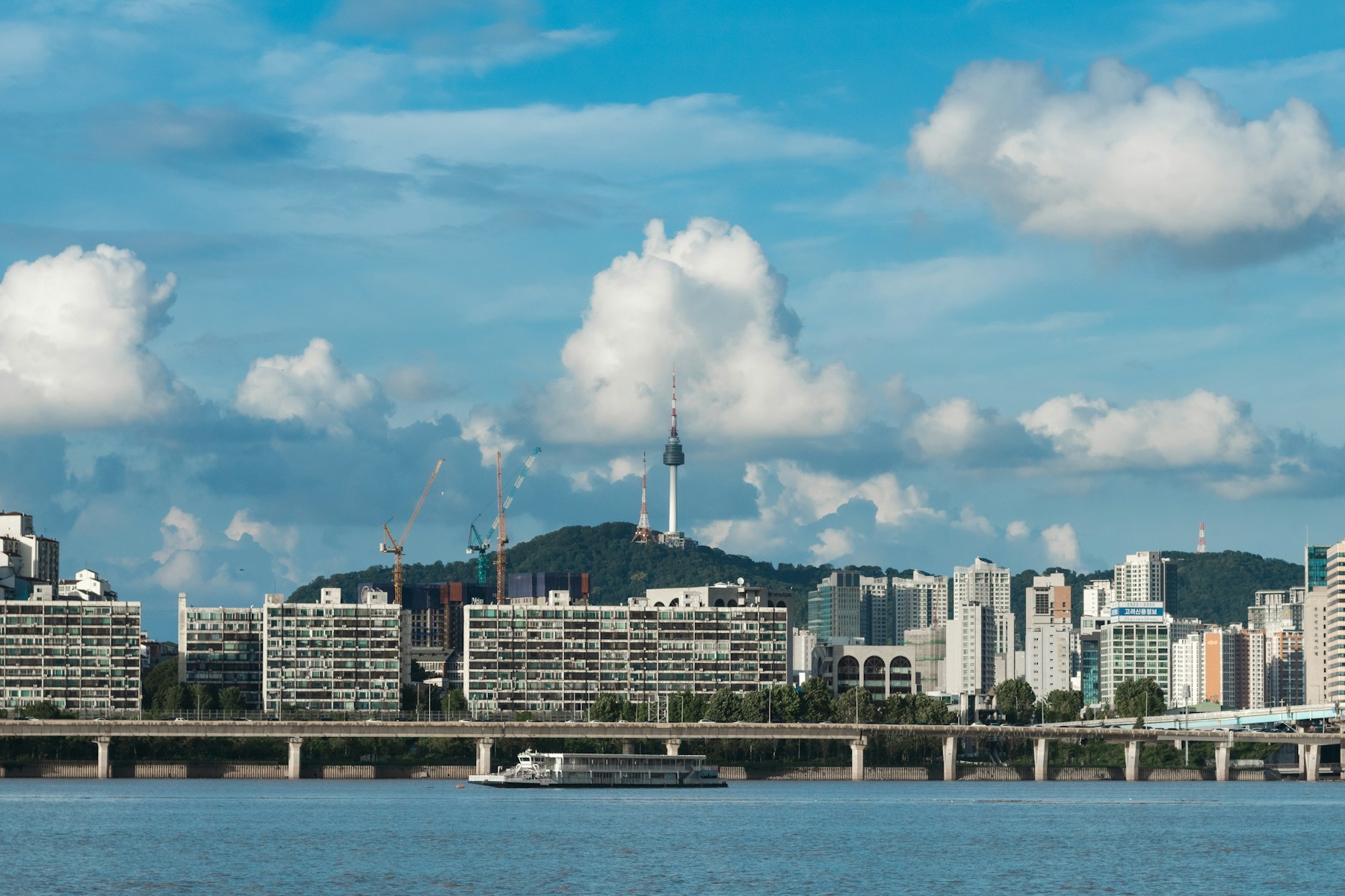 Seoul city skyline with N Seoul Tower rising above the city